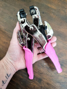 Punch grommets into cardboard