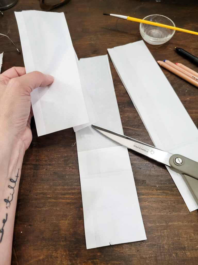 Use a lunch sack to create the cutest DIY utensil holders for Easter! This is the perfect craft to do with your kids, and use them all season before trashing them-- guilt free! #kidcraft #easterdiy #easyeastercraft