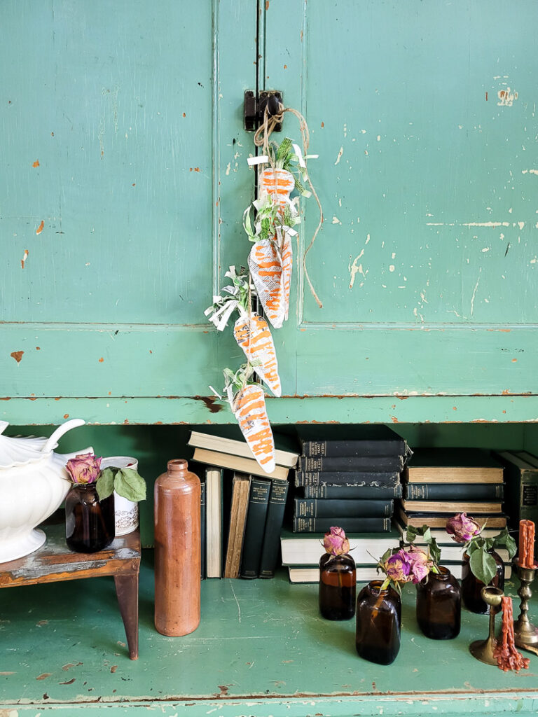 Using just a few simple supplies, you can make these gorgeous stuffed carrots for Easter and use them for years to come! #papercraft #easterdiy #budgetfriendlyeasterdecor #paperdiy