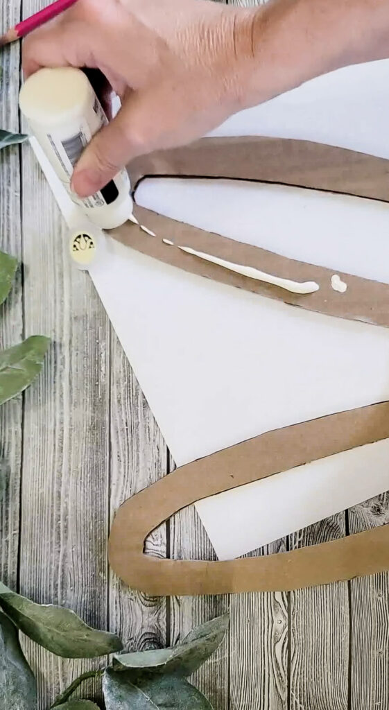 Watch cardboard get a mulligan as we recycle it into beautiful spring and easter decor in a matter of minutes! #easterdecor #springdecor #cardboardrecycle #easydiy #budgetfriendlyeasterdecor