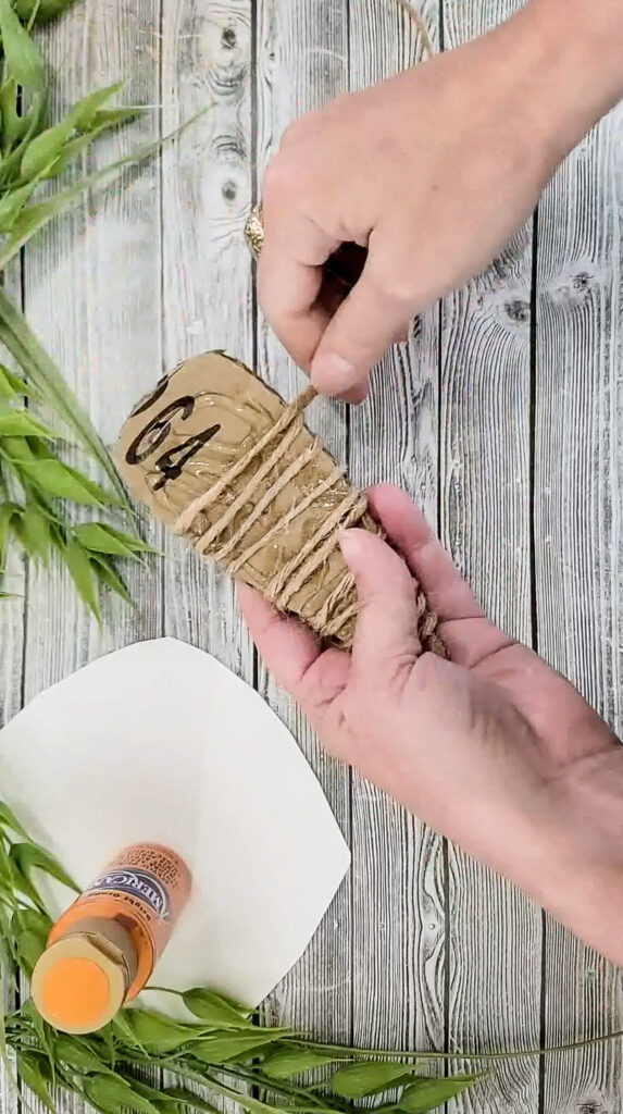 Using just a few simple supplies, you can make these gorgeous stuffed carrots for Easter and use them for years to come! #papercraft #easterdiy #budgetfriendlyeasterdecor #paperdiy