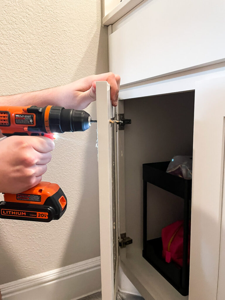 Adding beautiful hardware to your cabinets is easier than you might think... no contractor needed! Just a couple tools, a little time, and a little patience! After reading this, you'll want to add hardware to every cabinet in your home! #cabinethardware #cabinetjewelry #howto #cabinetpulls #cabinetknobs #easilyinstallcabinethardware