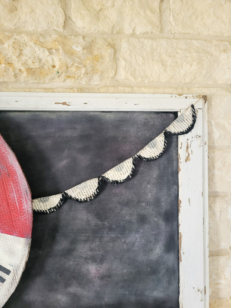 Make fun and easy holiday bunting from cardboard. Change up the color theme and you have precious bunting for 4th of JUly, Christmas, Easter or everyday! This rustic vintage style bunting can be made in any size, large cunting for your porch or mantel can get expensive, but this is the perfect low-budget alternative. Just keep it out of the rain! #cardboardcraft #paperproject #diygarland