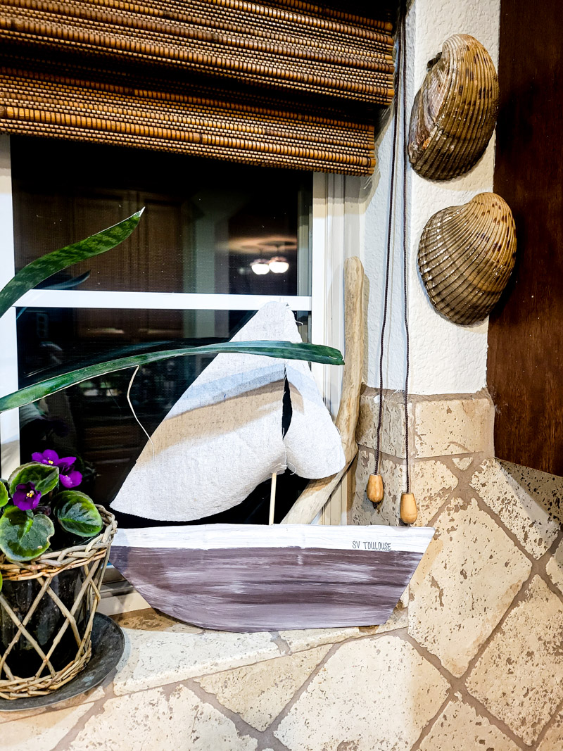 It's easy to make a DIY sailboat from cardboard, I'll show you how! Perfect for all of your summer decorating for years to come! #cardboard #sailboat #summerdecor 
