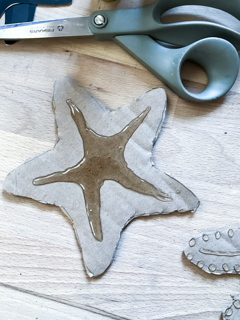 Use cardboard to make a beautiful DIY starfish and use as nautical decor! #cardboard #starfish #nautical #beach