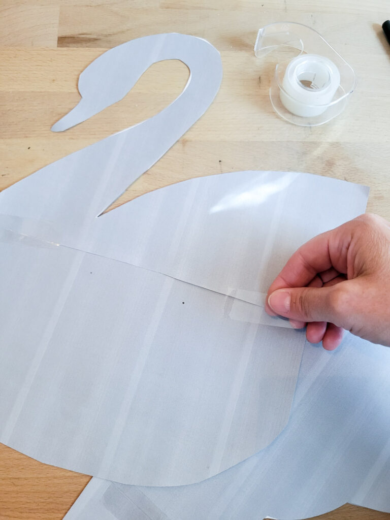 hunting for vintage swan decor and having a hard time finding it on a budget? No worries - make your own with this quick and easy cardboard project! I provide the pattern for a large swan decor piece and you do the simple work of cutting and painting! Make your vintage summer vignettes complete with this beautiful high-end craft project! #cardboarddecor #swandecor #vintagesummer