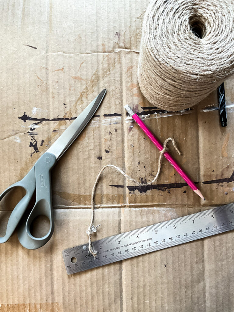 Make a life-size life preserver for vintage summer decorating. This large cardboard project will add a vintage vibe to your beach house, summer vignette or nautical decor motif. So easy and super budget-friendly. #budgetsummerdecor #beachtheme #vintagestylesummer