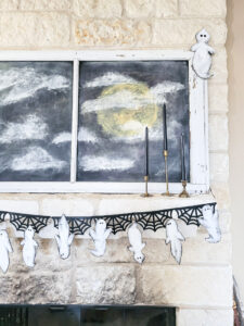 Cheap Halloween decor idea! Grab this free pattern! Free ghost pattern for DIY cardboard ghosts, perfect for your Halloween mantle or Halloween tablescape. Make sweet Halloween ghosts or scary Halloween ghouls with this budget friendly Halloween craft! #cardboardcraft #cheapHalloween #Halloweengarland #freeHalloweendecor