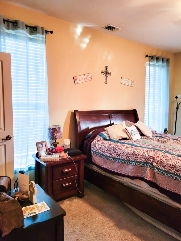 Master bedroom redo. Vintage paint color palette and budget curtain hack, get the look for less from Ballard Design. Buffalo check curtains make big impact for cheap. #greenbedroom #vintagebedroom #taxidermy #affordablecurtains