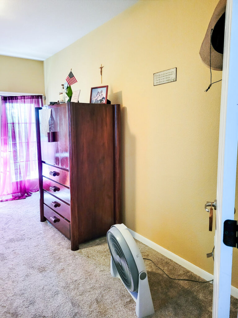 Master bedroom redo. Vintage paint color palette and budget curtain hack, get the look for less from Ballard Design. Buffalo check curtains make big impact for cheap. #greenbedroom #vintagebedroom #taxidermy #affordablecurtains