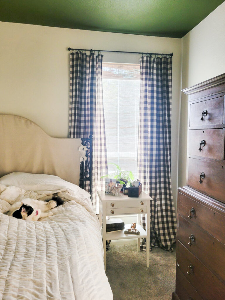 Master bedroom redo. Vintage paint color palette and budget curtain hack, get the look for less from Ballard Design. Buffalo check curtains make big impact for cheap. #greenbedroom #vintagebedroom #taxidermy #affordablecurtains