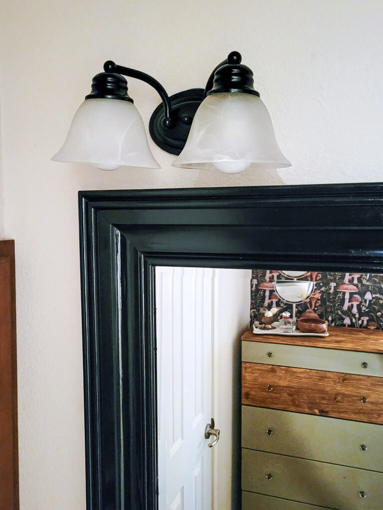 If you are looking for some budget bathroom makeover ideas you can finish in a day, these easy ideas are for you. Use what you have and give your bathroom a facelift with a small budget.One of the easiest bathroom updates is to paint light fixtures, it's such a cheap bathroom update anyone can do. #paintedlightfixture #spraypaintmakeover #budgetlighting