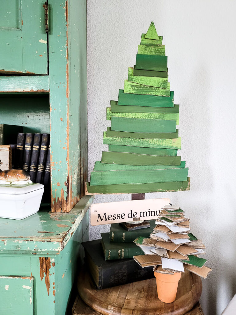 Here's 2 ways to make cardboard Christmas trees. Each one budget-friendly, easy, and seriously SO precious! #cardboard #christmasdiy #cardboarddiy #diychristmasdecor