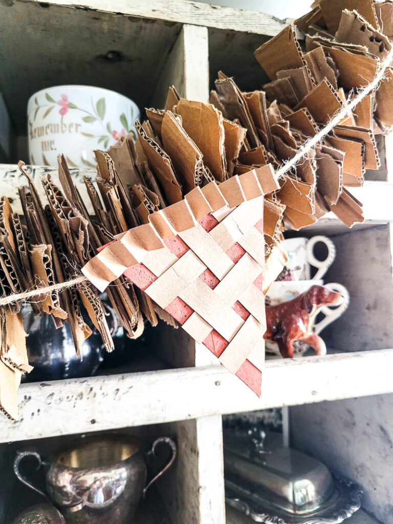 Keep your Fall decor in budget this year with this DIY pie garland made from cardboard and paper! So cute and easy!
