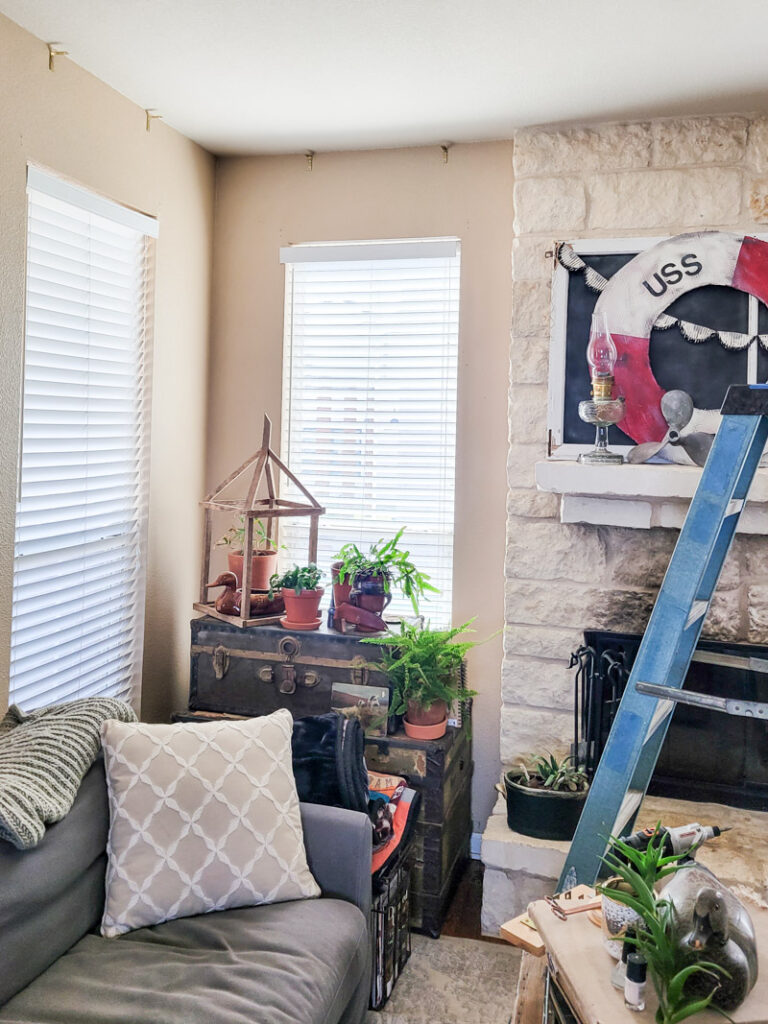 how to make DIY no-sew curtains for a farmhouse feel. This easy no sew curtain idea is perfect for decorating beginners and budget decorating enthusiasts! Drop cloth curtains are cheap and the perfect neutral curtain to accent a room. You can sew up this curtain tutorial but a little fabric glue will do the trick. If you are looking for the perfect white curtains or neutral curtain decor, this is the window valance idea for you! #DIYcurtain #budgetcurtain #nowsewwindowtreatment #nosewcurtain