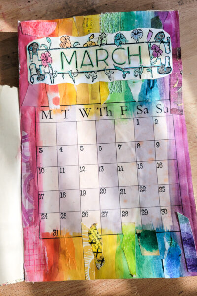 Junk journal calendar planner flip through for the month of March. Inspired by the rainbow this colorful imagery of God's promise is perfect for organizing my days in the one of a kind day planner I created! #journalgirl #calendarflip #junkjournalideas #mixedmediajournal